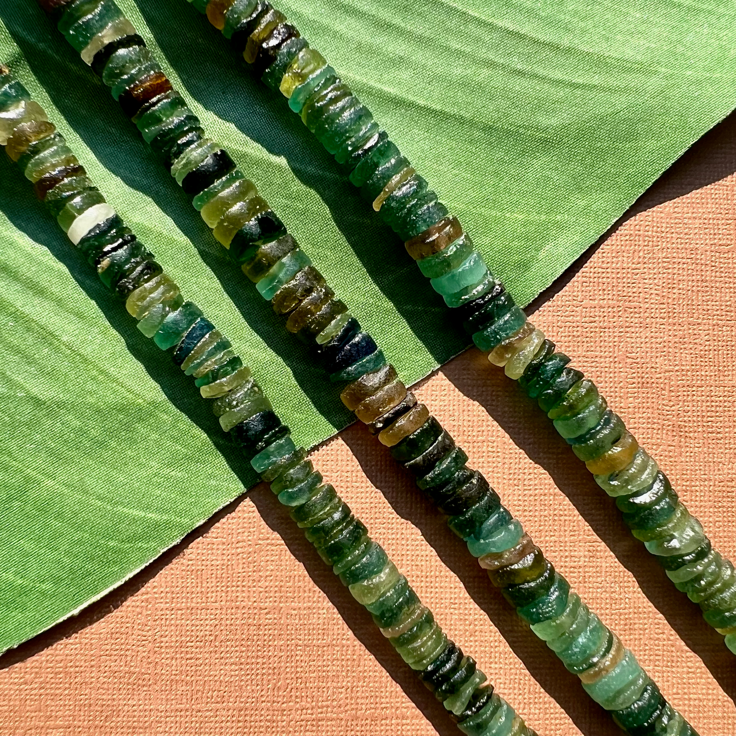 Roman Glass 9mm to 11mm Cylinder Bead Strands