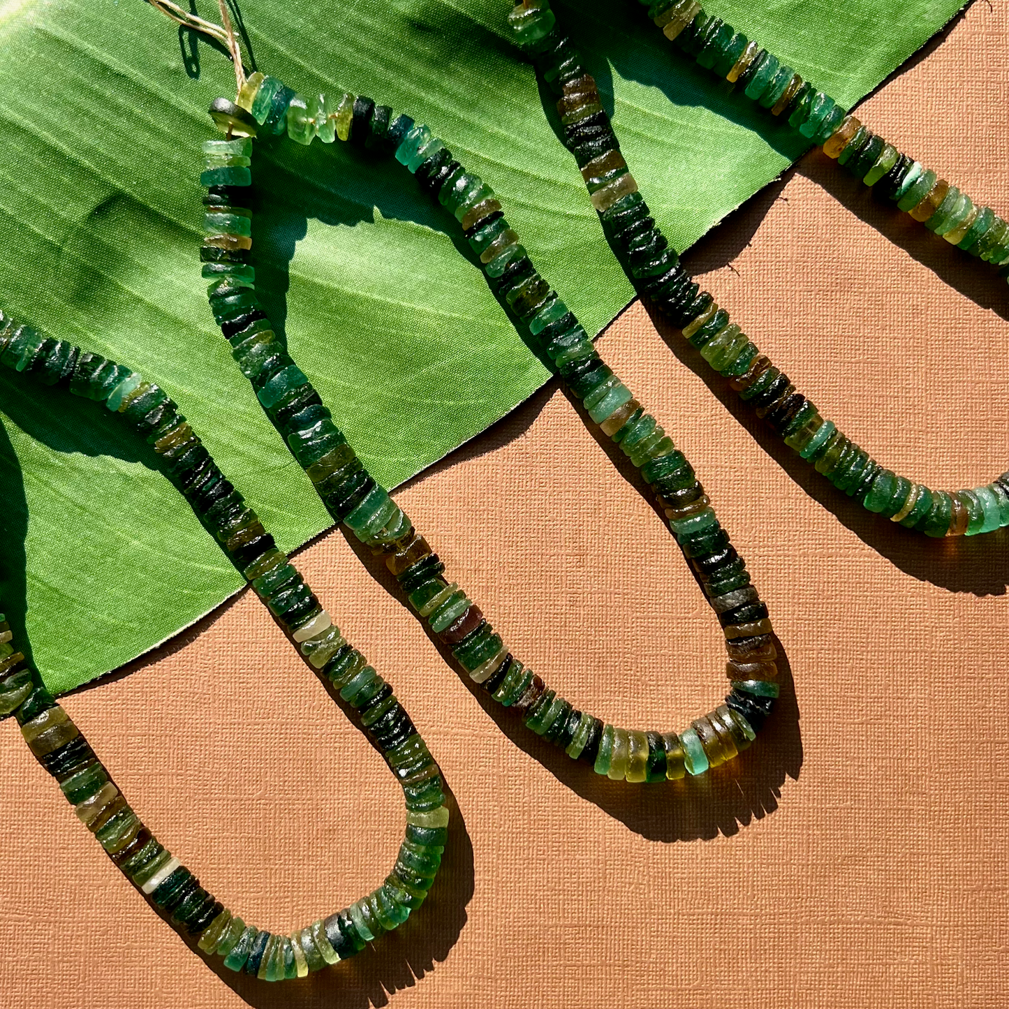 Roman Glass 9mm to 11mm Cylinder Bead Strands