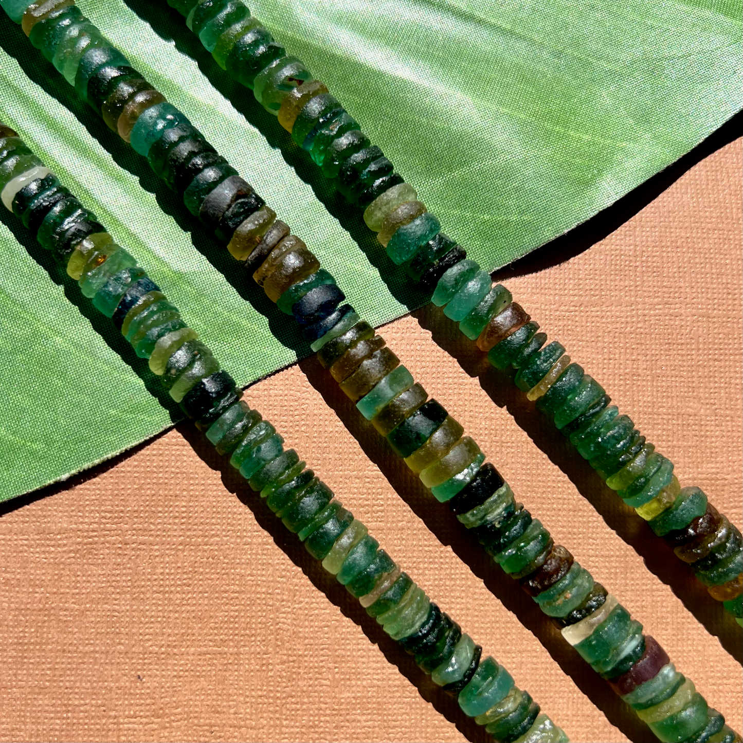 Roman Glass 9mm to 11mm Cylinder Bead Strands
