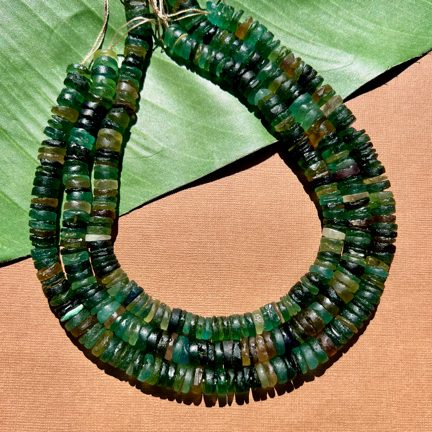 Roman Glass 9mm to 11mm Cylinder Bead Strands