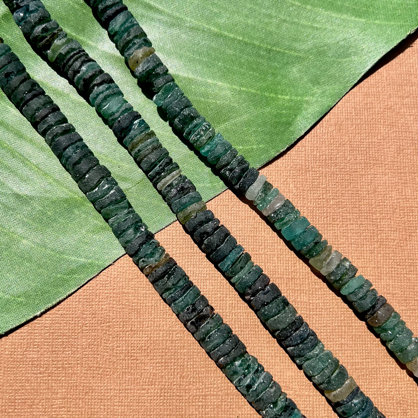 Roman Glass 9mm to 11mm Cylinder Bead Strands