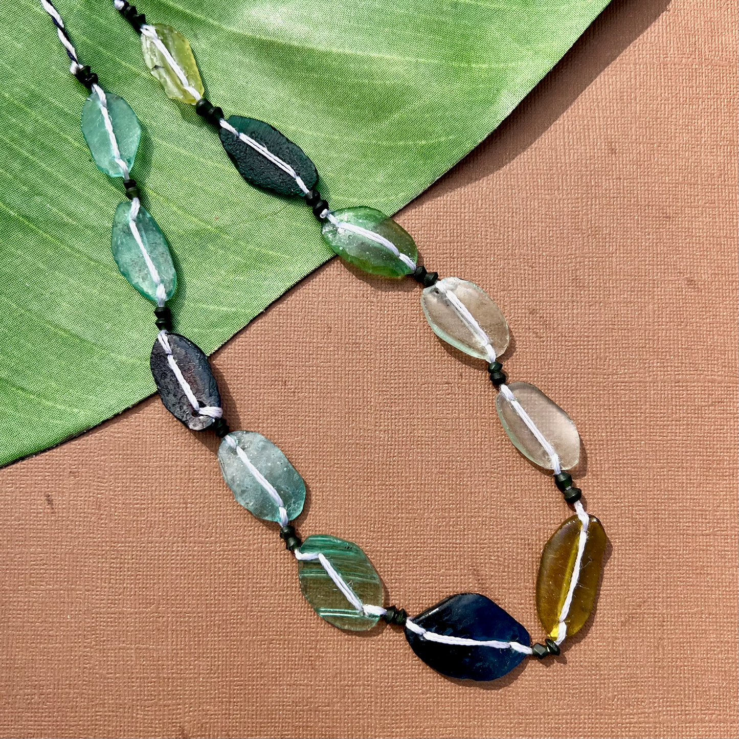 Roman Glass Flat Oval Bead Strands