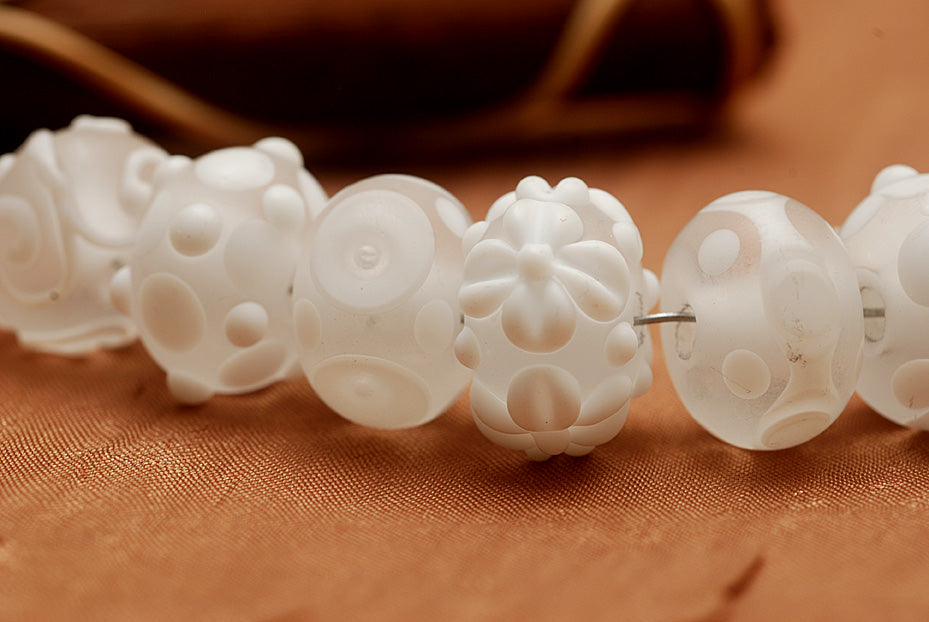 10204001 - Seven Baby Floral White Rondelle Beads