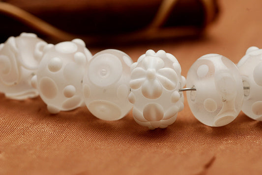 10204001 - Seven Baby Floral White Rondelle Beads