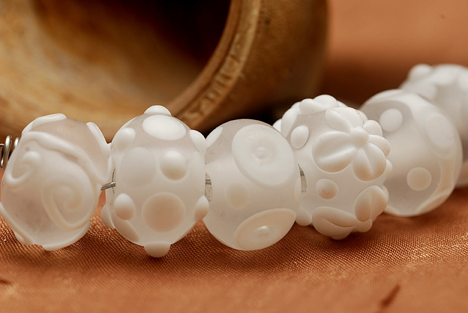 10204001 - Seven Baby Floral White Rondelle Beads