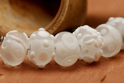 10204001 - Seven Baby Floral White Rondelle Beads