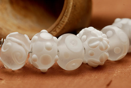 10204001 - Seven Baby Floral White Rondelle Beads