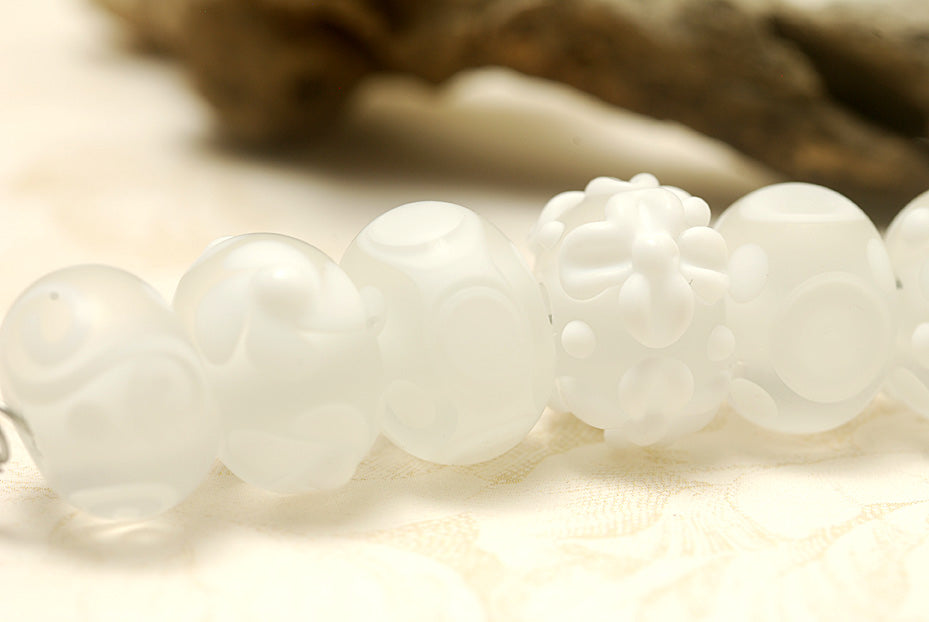 10204001 - Seven Baby Floral White Rondelle Beads