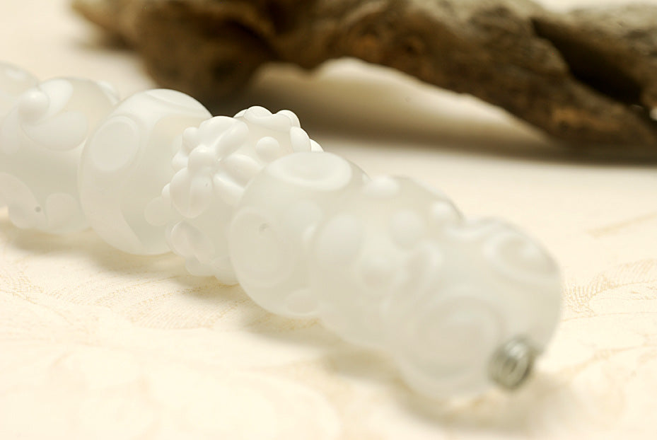 10204001 - Seven Baby Floral White Rondelle Beads