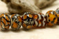 10302601 - Seven Animal Print Rondelle Beads