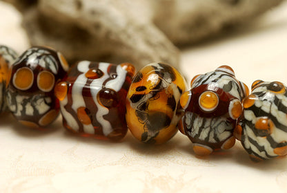 10302601 - Seven Animal Print Rondelle Beads