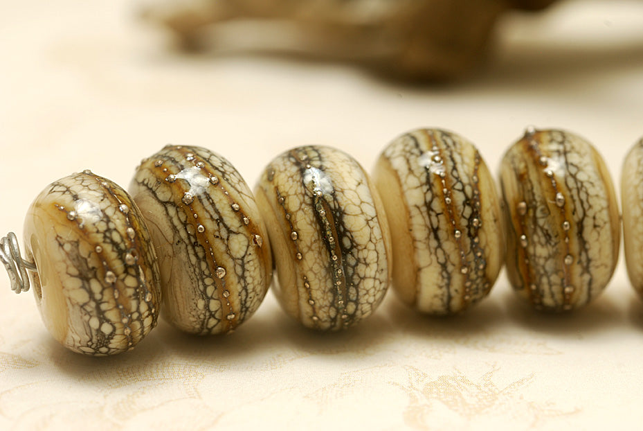 10306001 - Seven Dark Ivory w/Silver Rondelle Beads