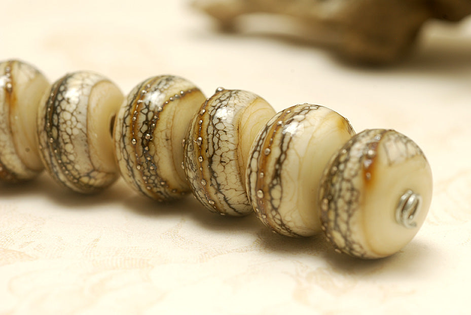 10306001 - Seven Dark Ivory w/Silver Rondelle Beads