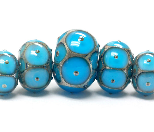 10409011 - Five Teal Blue w/Metal Dots Graduated Rondelle Beads