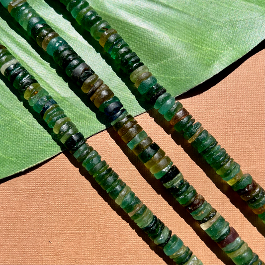 Roman Glass 9mm to 11mm Cylinder Bead Strands