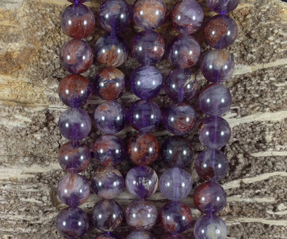 Auralite 23 aka Amethyst w/ Hematite Inclusions Round