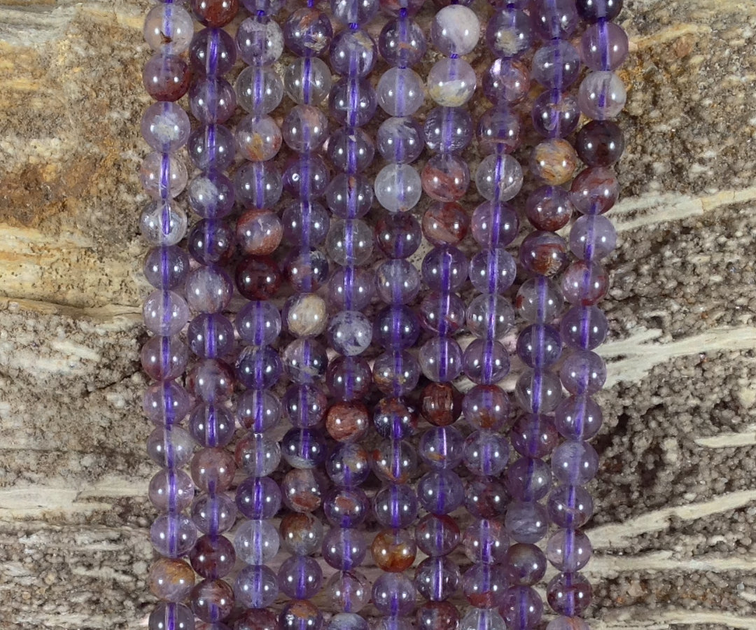Auralite 23 aka Amethyst w/ Hematite Inclusions Round