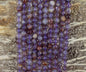 Auralite 23 aka Amethyst w/ Hematite Inclusions Round